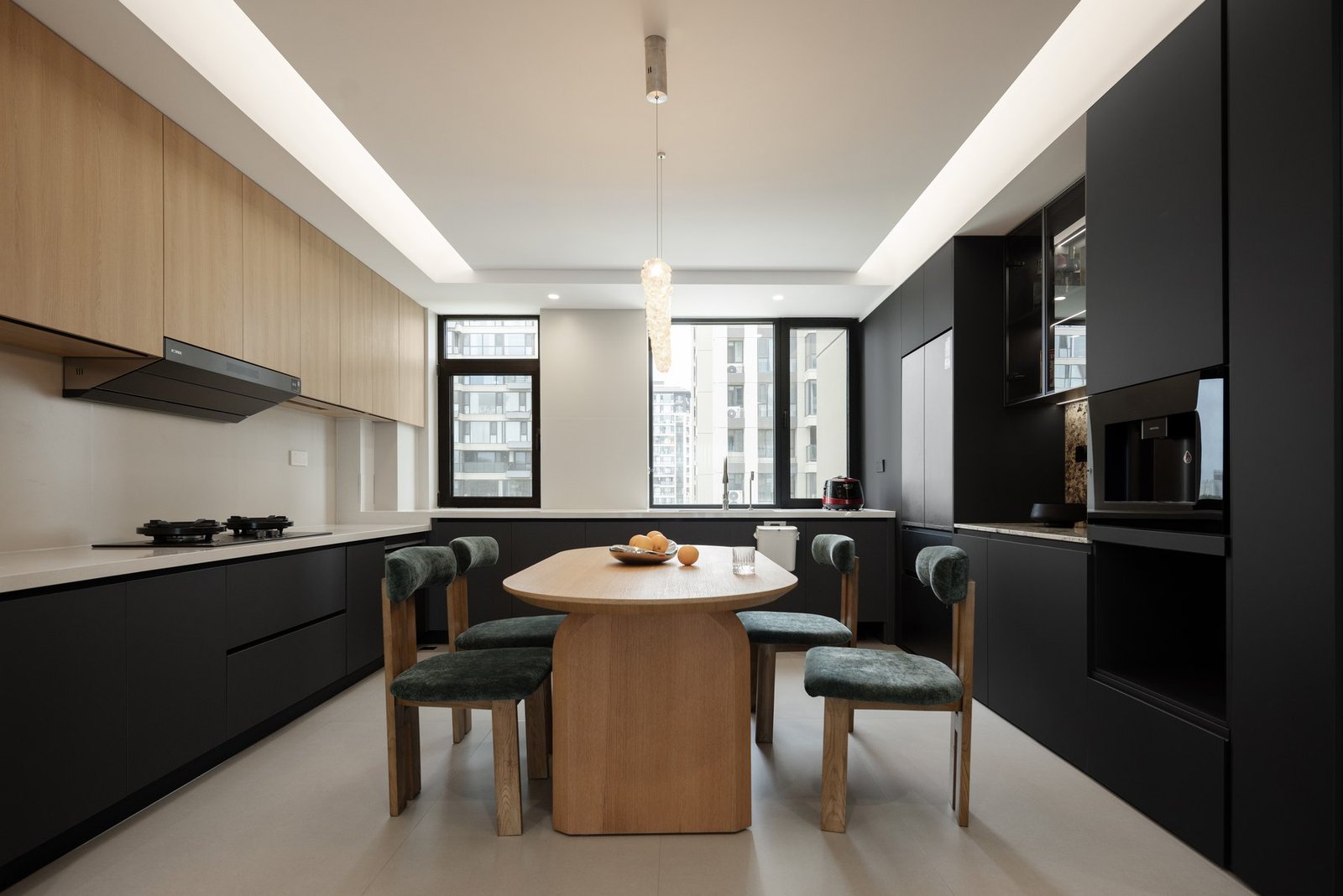 Completed kitchen and dining area with oak table and dark cabinetry