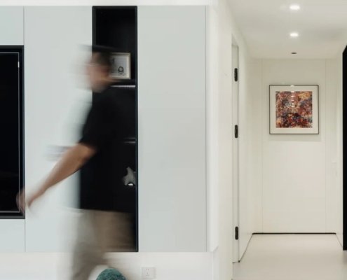 Open-plan family home with a blurred figure in motion