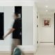 Open-plan family home with a blurred figure in motion