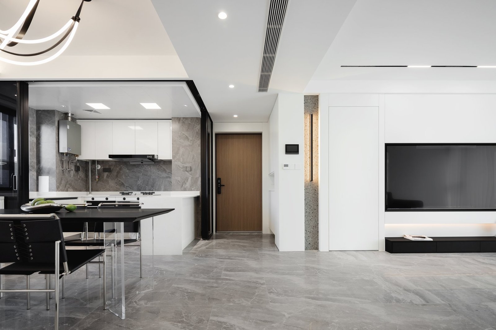 Continuous view across the completed kitchen, dining and living spaces