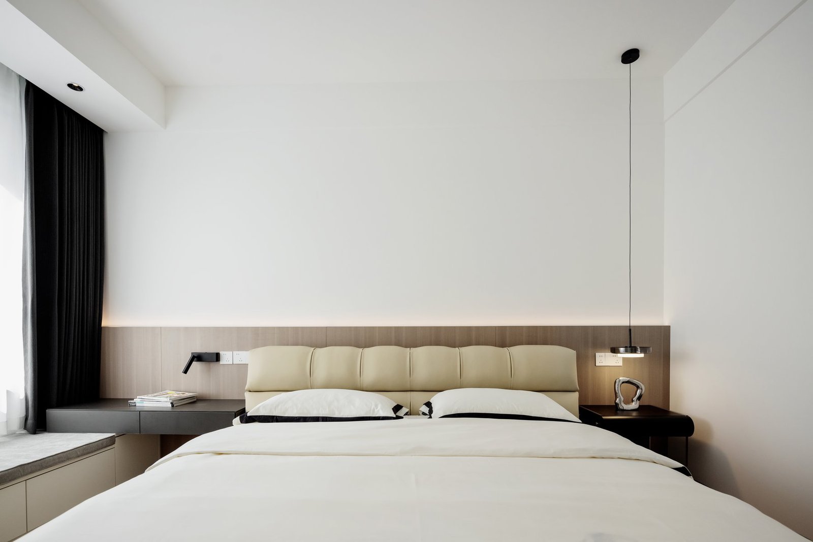 Completed main bedroom with warm timber headboard
