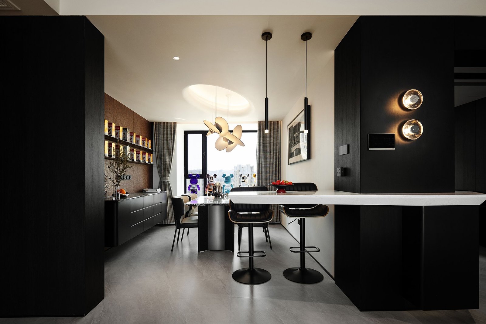 Dining area and white stone bar integrated into the structural wall
