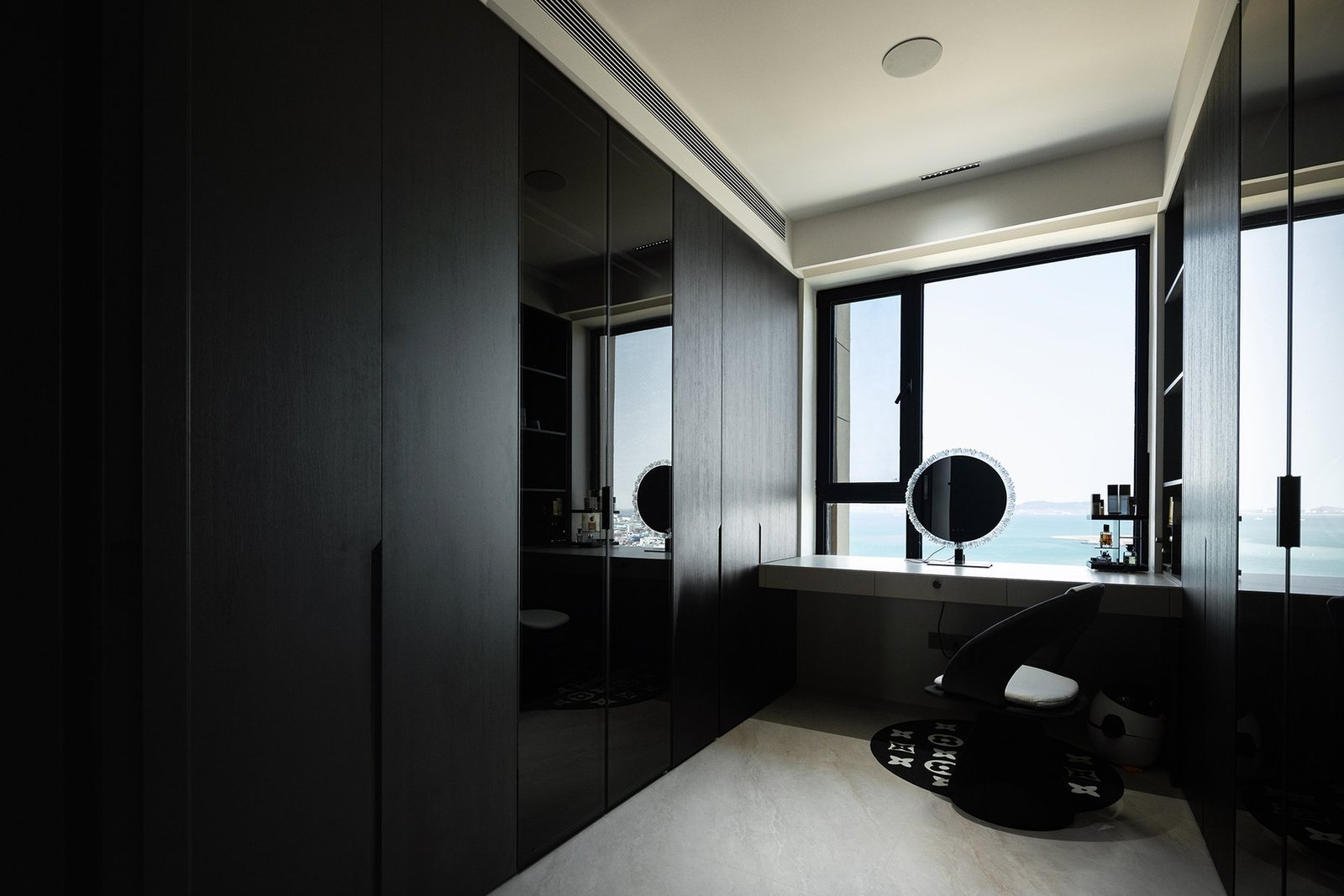 Completed walk-in wardrobe with window-side dressing table