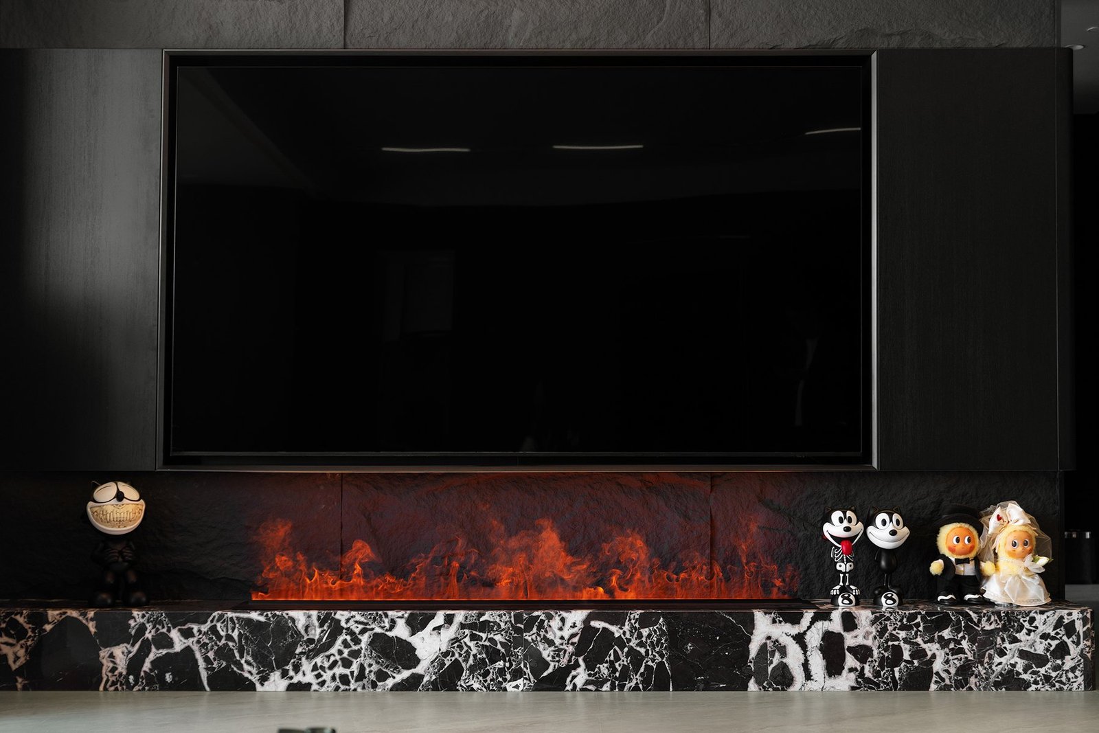 Steam fireplace beneath the television wall