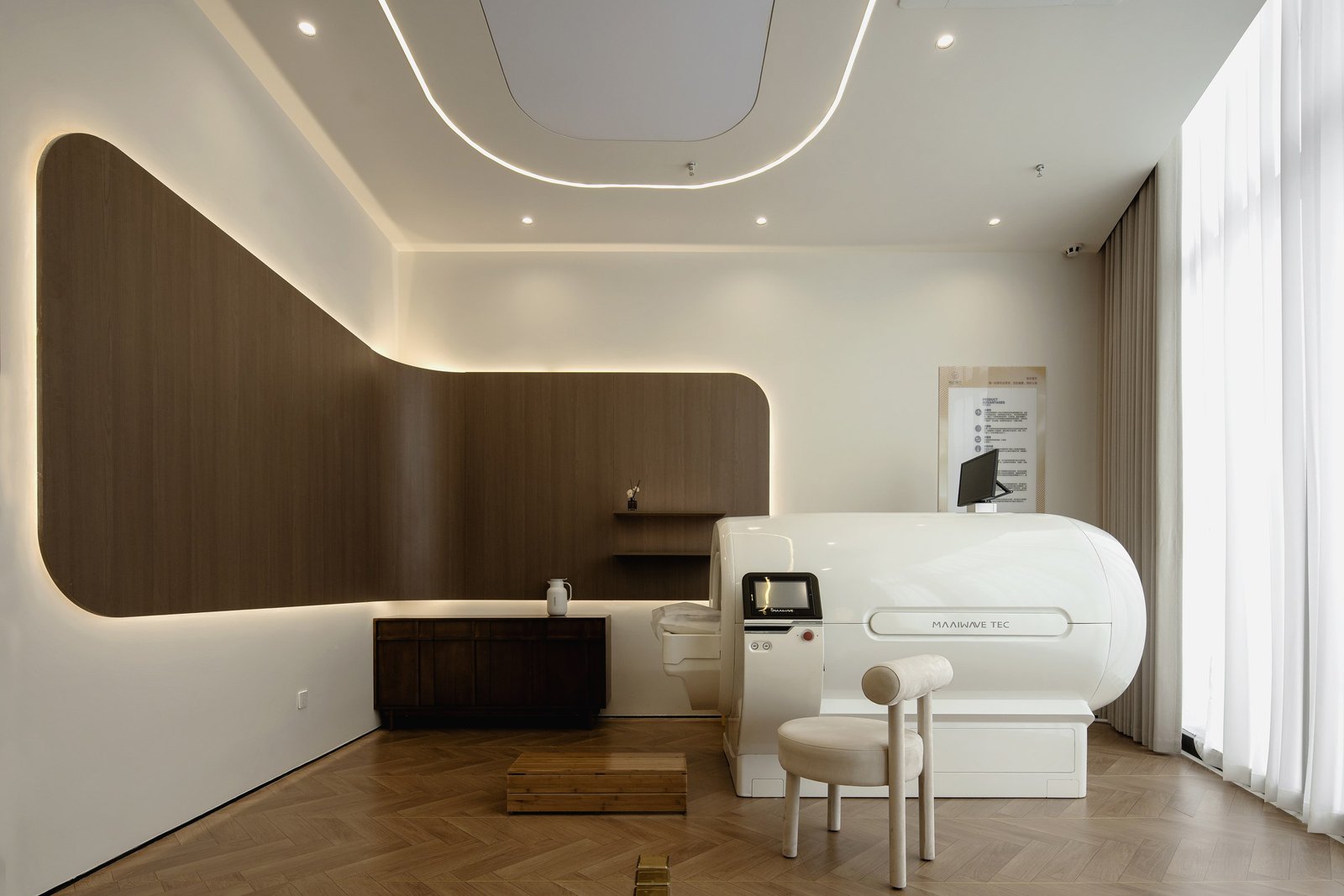 Daylit treatment room with integrated cabinetry and softly curved wall details