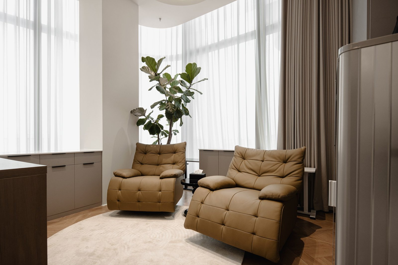 Quiet relaxation room with two reclining chairs and natural daylight