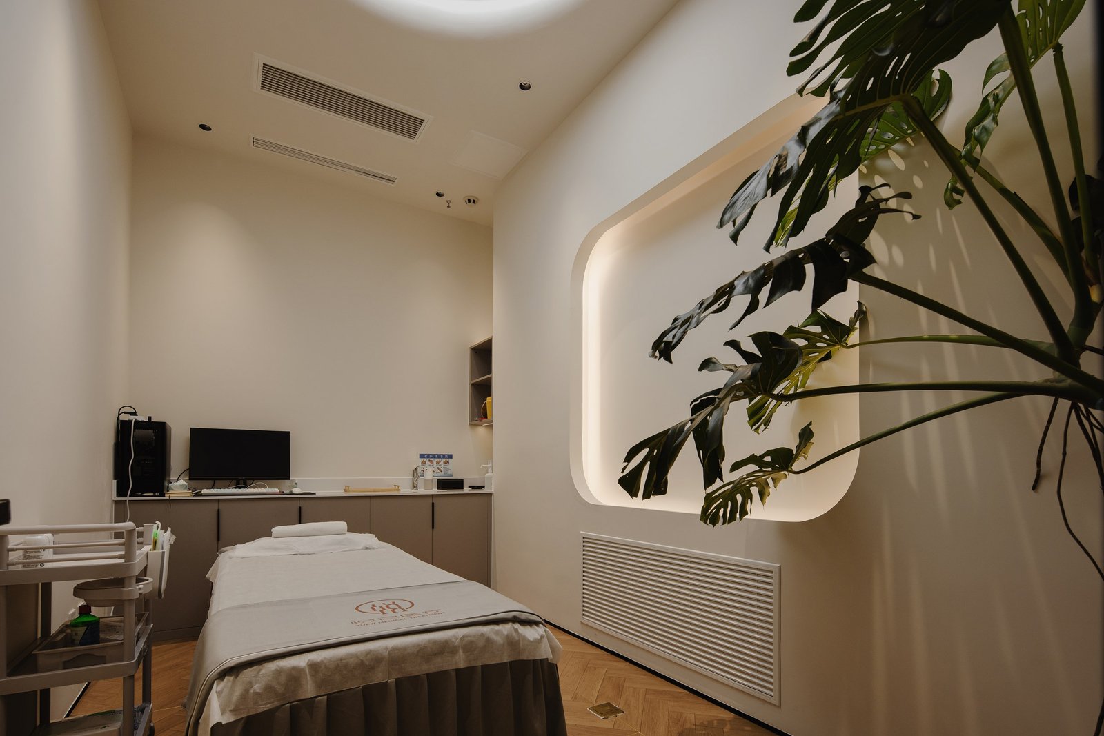 Private treatment room with concealed lighting and integrated equipment
